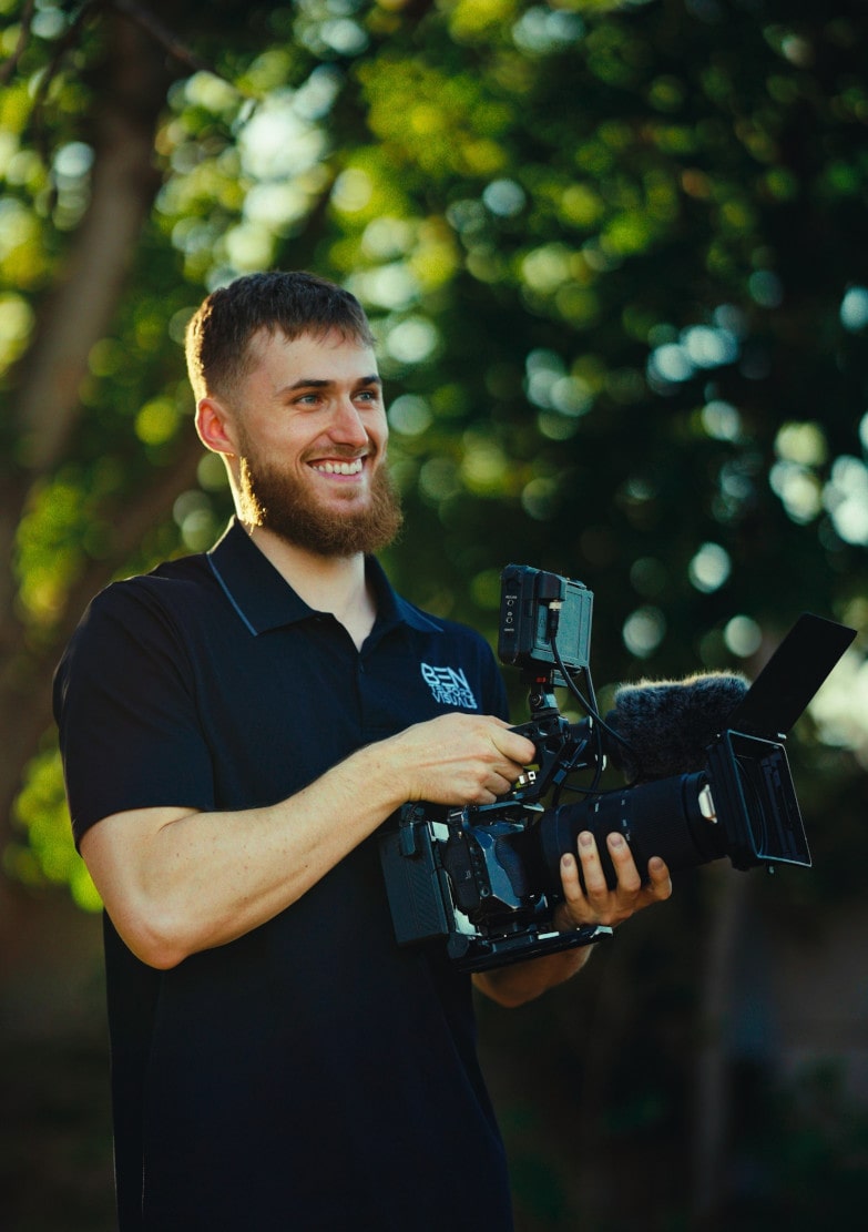 Ben Telford filming on field